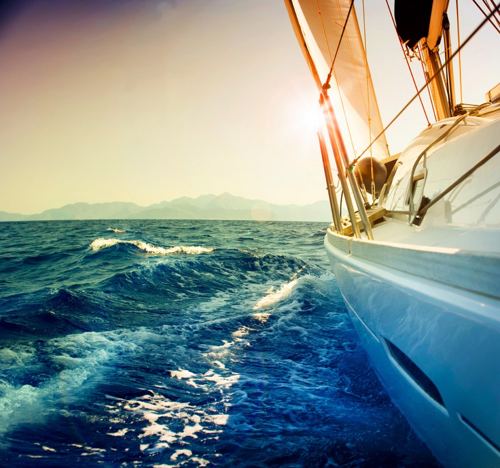 Yacht-Sailing-against-sunset.Sailboat.Sep-ia-toned_84543808